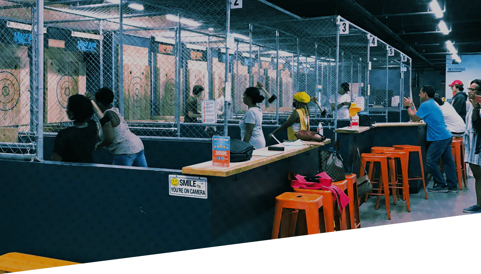 Half Axe facility full of people enjoying axe throwing